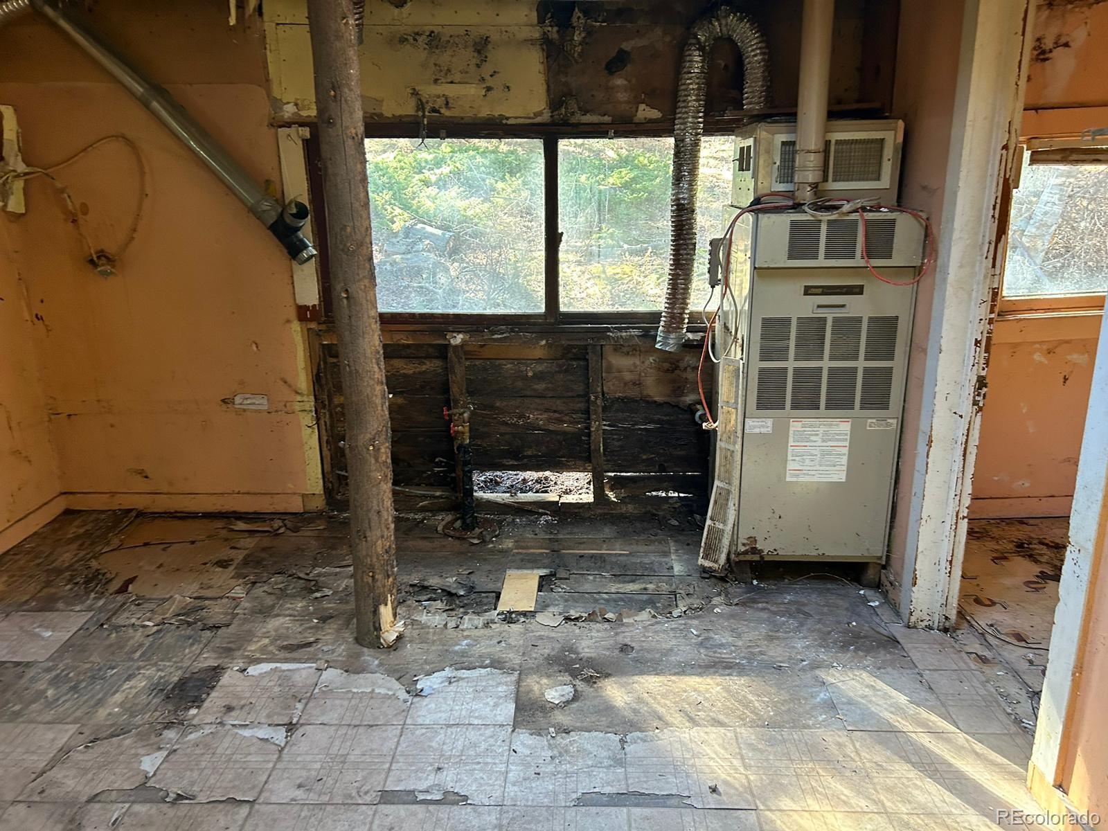 10881 Kitty Drive Conifer, CO 80433 - Photo 12 of 29 a view of a porch with a table and chairs