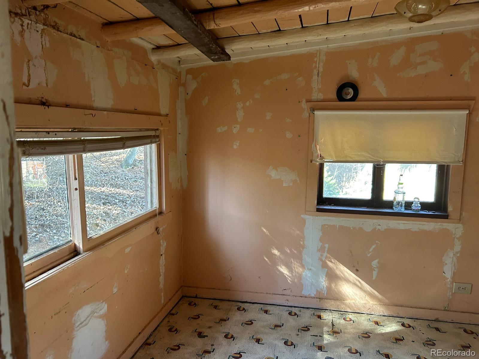 10881 Kitty Drive Conifer, CO 80433 - Photo 13 of 29 a view of a door and wooden floor
