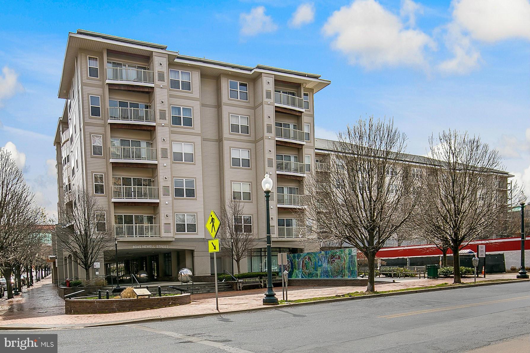 8045 Newell Street, Unit 513 Silver Spring, MD 20910 - Photo 1 of 21 a front view of a building with street view