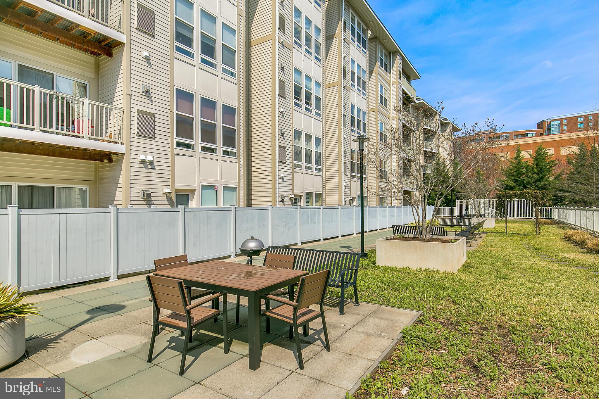 8045 Newell Street, Unit 513 Silver Spring, MD 20910 - Photo 18 of 21 a view of a swimming pool with a lounge chairs