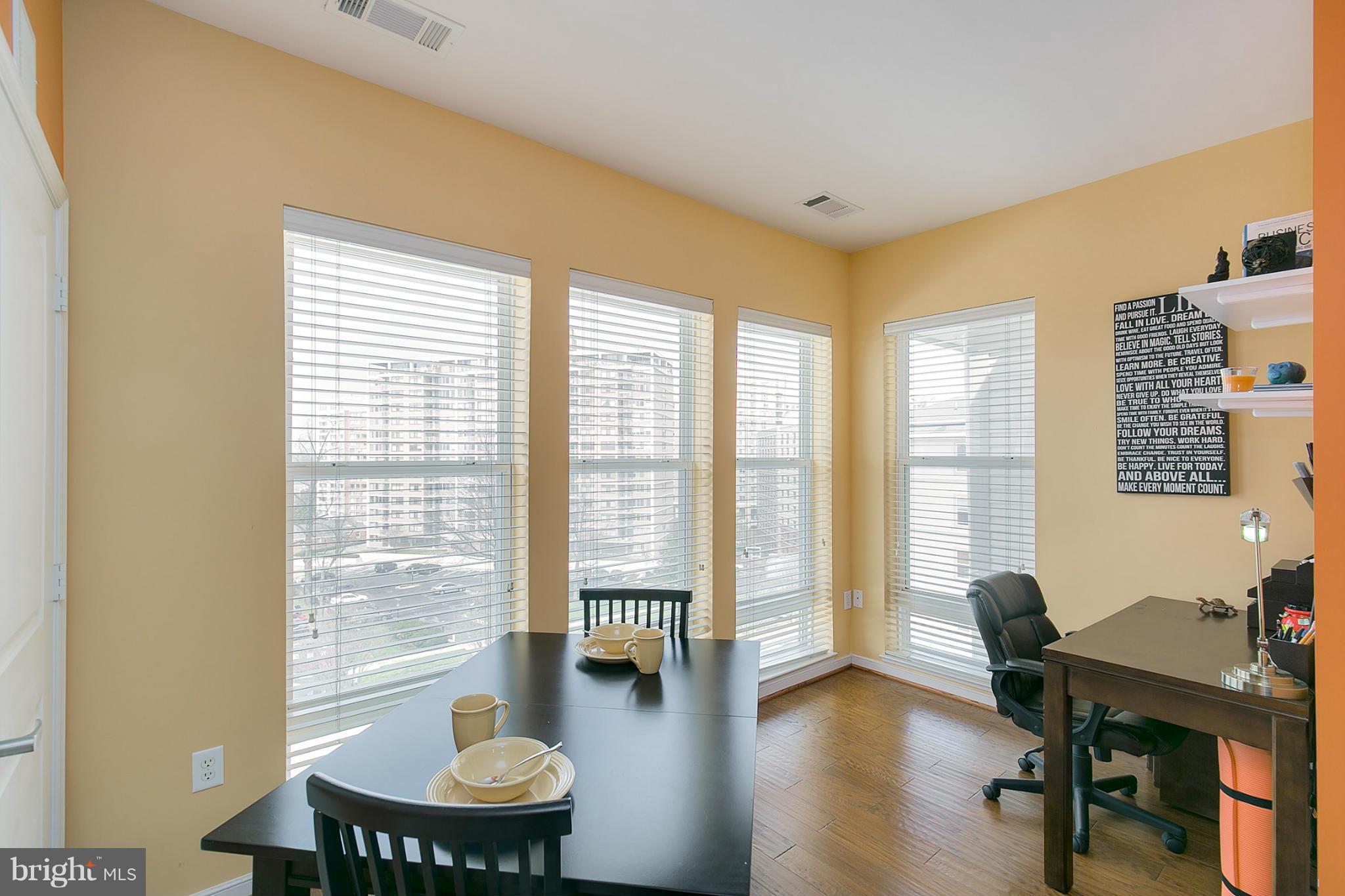 8045 Newell Street, Unit 513 Silver Spring, MD 20910 - Photo 10 of 21 a view of a livingroom with workspace and a window