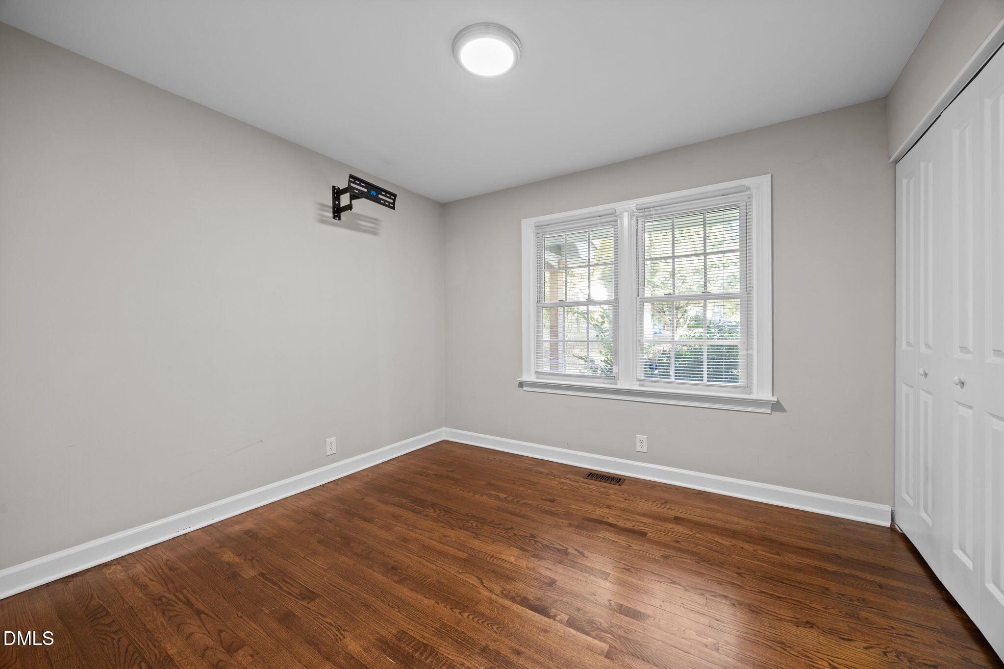 2950 Glenridge Drive Raleigh, NC 27604 - Photo 38 of 53 an empty room with wooden floor and windows