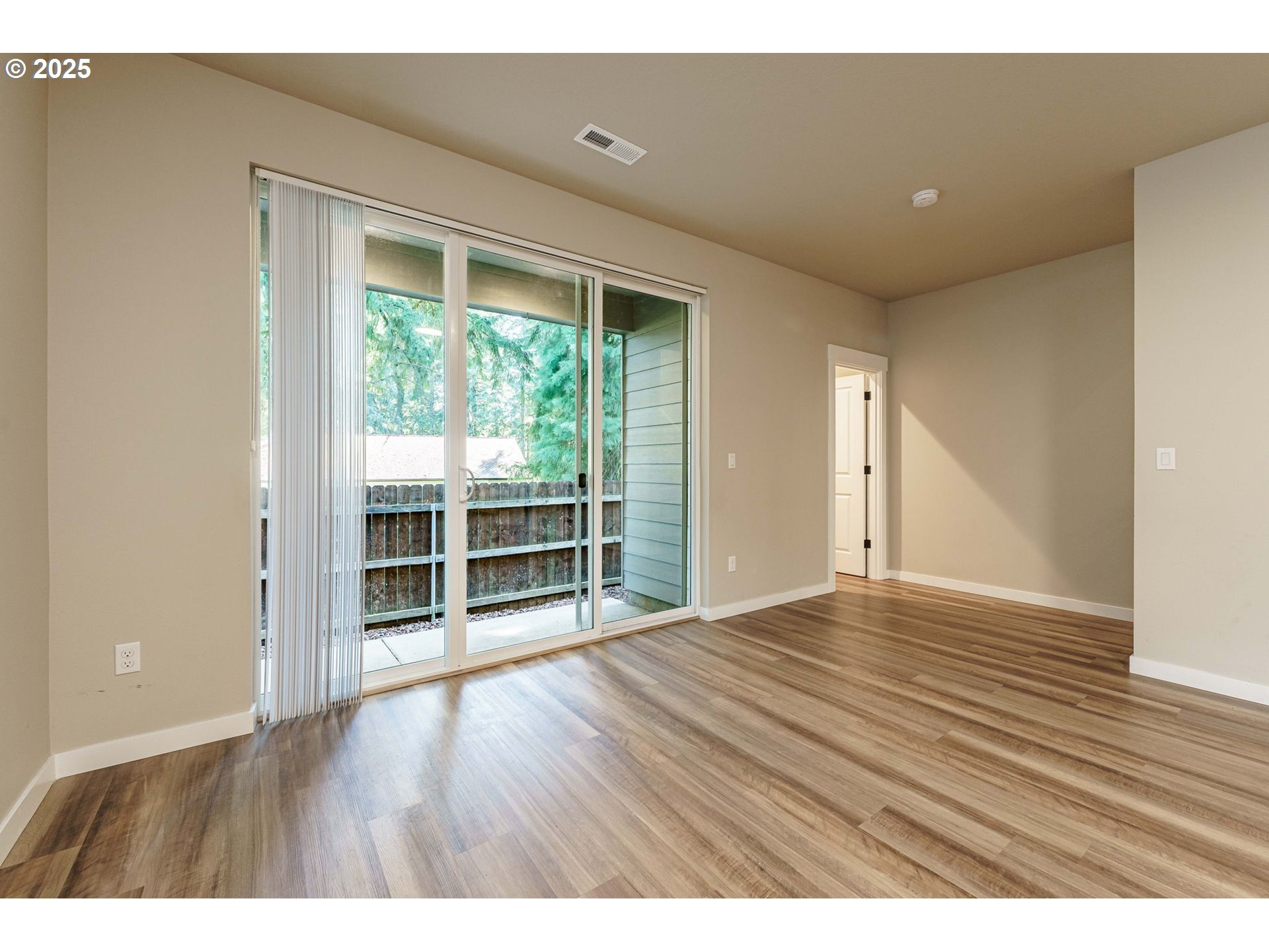 7135 South 13th Street Ridgefield, WA 98642 - Photo 15 of 40 wooden floor in an empty room with a window