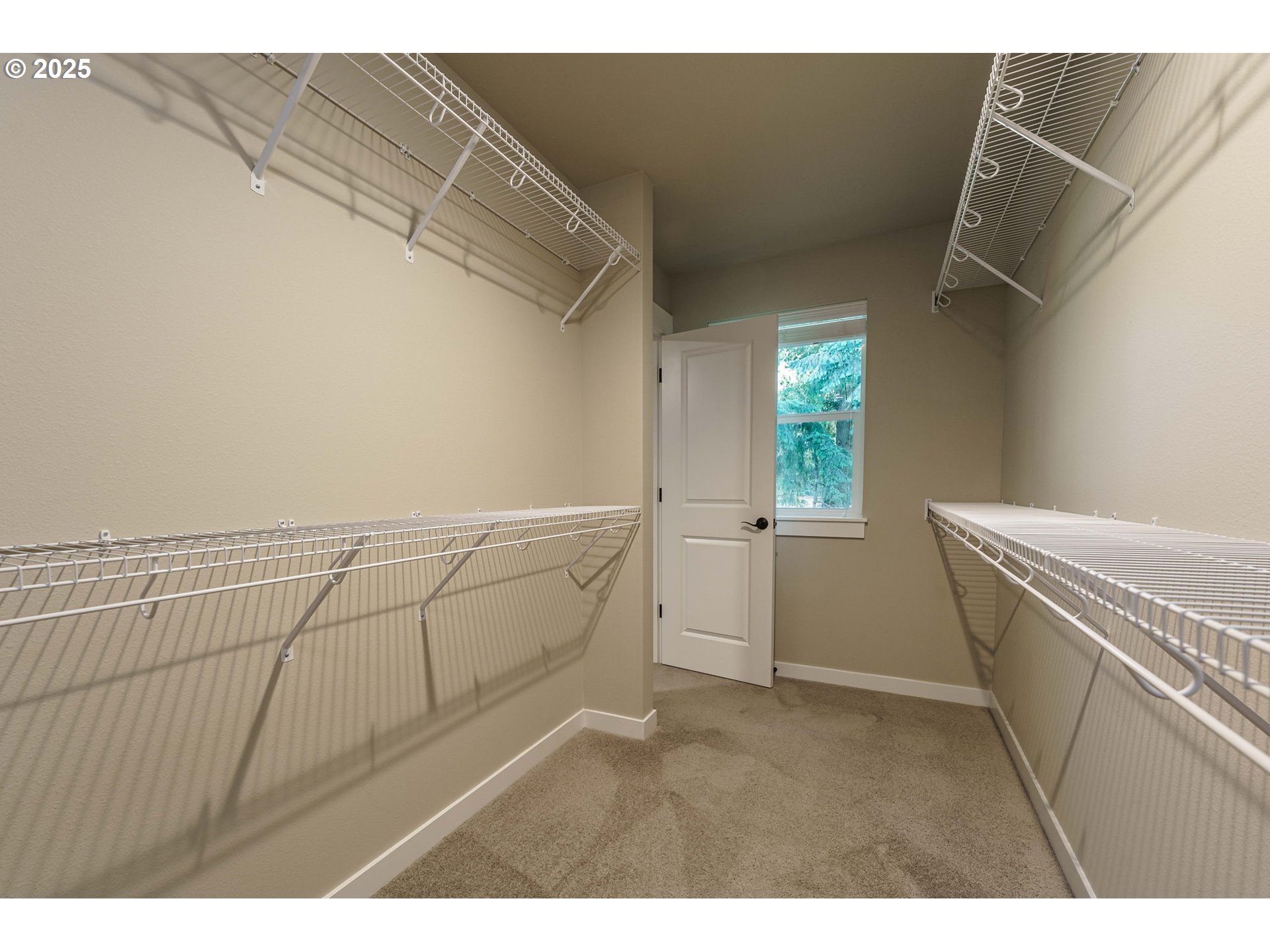 7135 South 13th Street Ridgefield, WA 98642 - Photo 23 of 40 a view of storage and utility room with racks on the wall