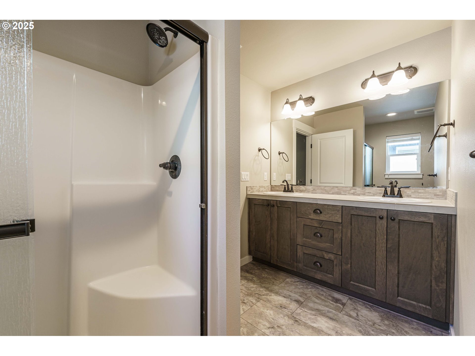 7135 South 13th Street Ridgefield, WA 98642 - Photo 26 of 40 a bathroom with a sink and a mirror