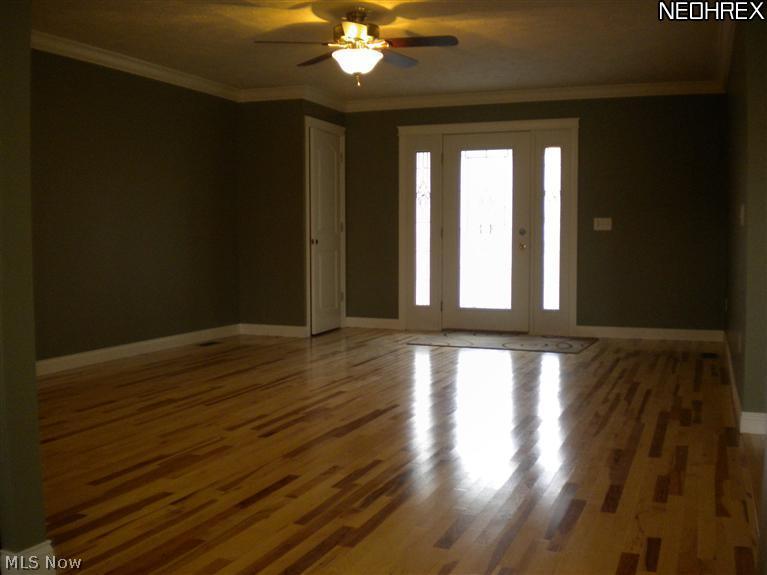 308 Barrington Ridge Road Painesville, OH 44077 - Photo 2 of 14 Family room with Hickory hardwood and crown molding