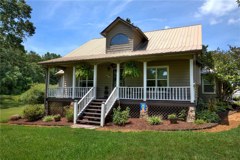 1932 Riverbend Road Southwest Plainville, GA 30733 - Photo 1 of 1 a view of a house with a yard
