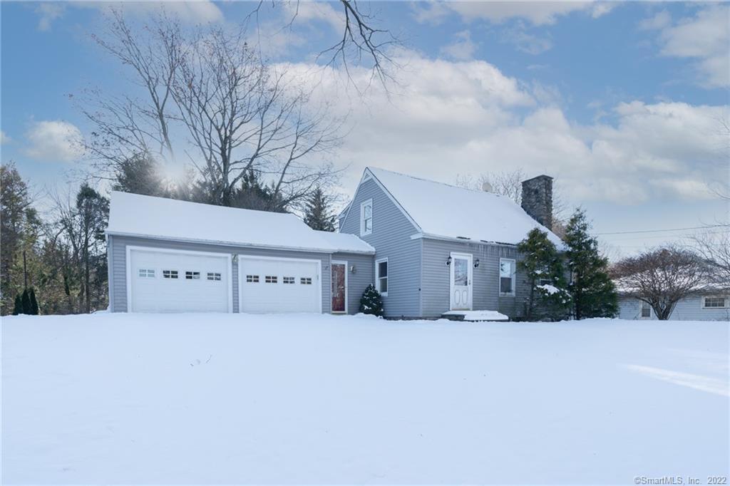 54 Candee Hill Road Watertown, CT 06795 - Photo 1 of 1 a front view of a house with a yard and garage
