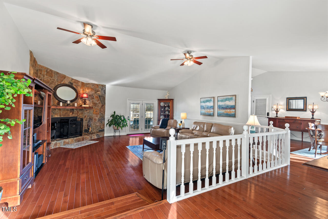 7409 Blalock Road Bahama, NC 27503 - Photo 4 of 43 a bedroom with furniture and a fireplace