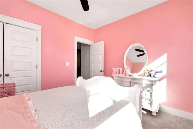 a view of walk in closet with clothes