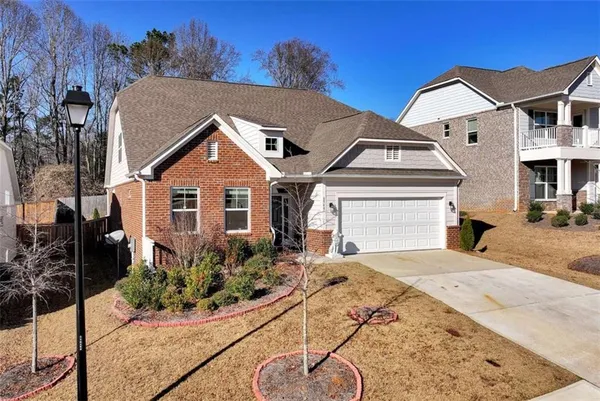 a front view of a house with a yard