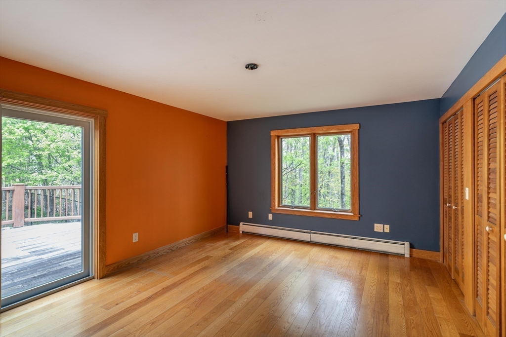 184 W Road Bernardston, MA 01337 - Photo 28 of 41 a view of an empty room with wooden floor and a window