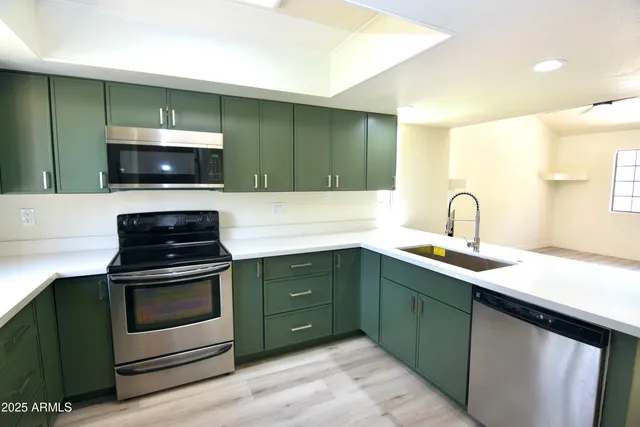 a kitchen with a sink and a microwave