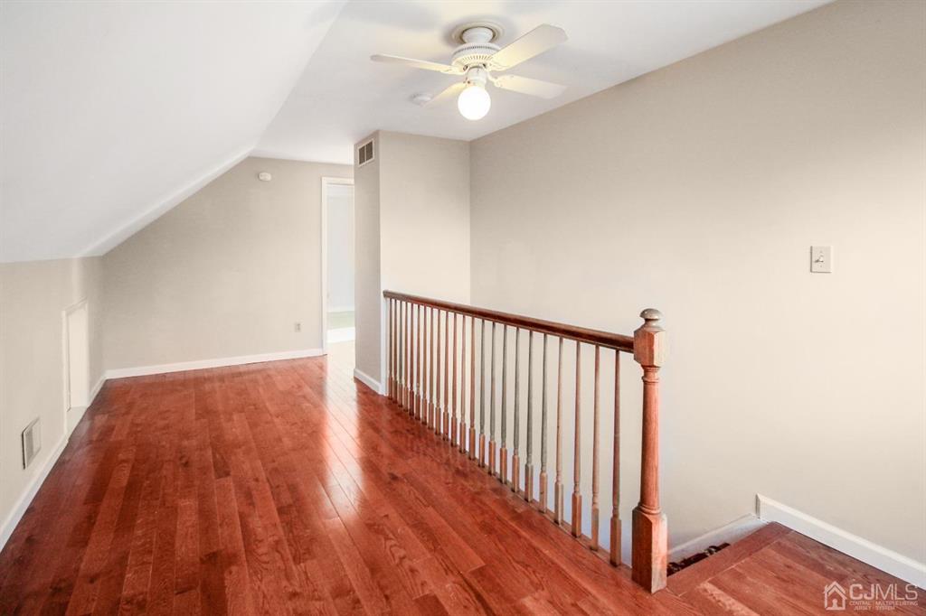 49 Racetrack Road East Brunswick, NJ 08816 - Photo 16 of 20 a view of a hallway with wooden floor