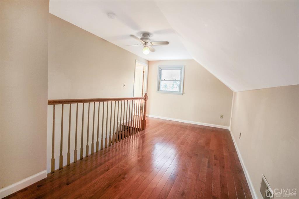 49 Racetrack Road East Brunswick, NJ 08816 - Photo 18 of 20 a view of a hallway with wooden floor