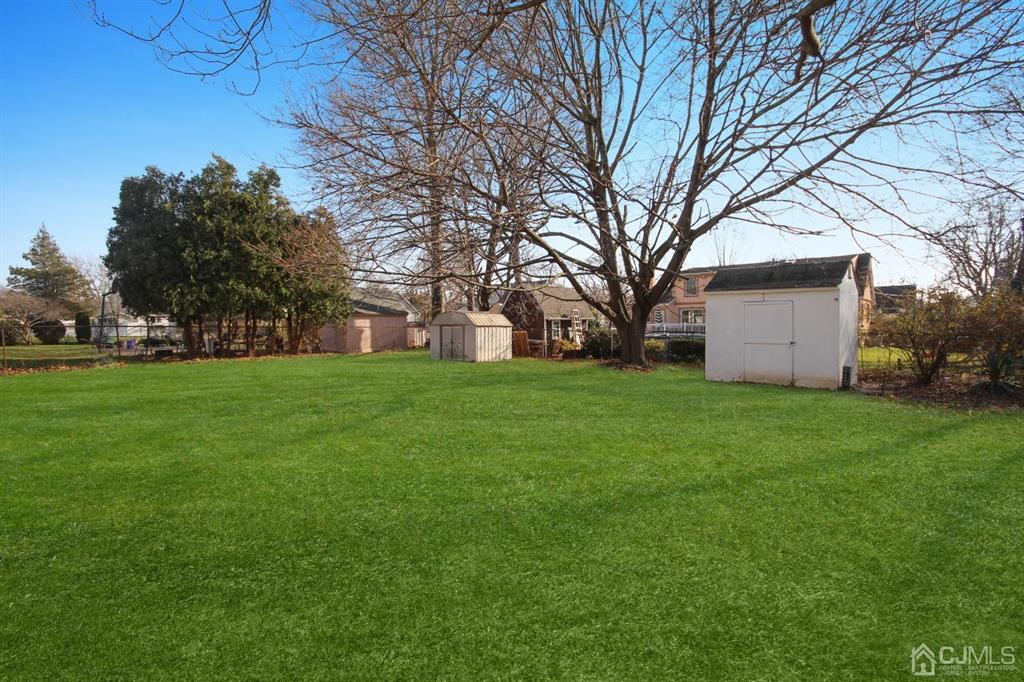 49 Racetrack Road East Brunswick, NJ 08816 - Photo 20 of 20 a view of a house with backyard and tree