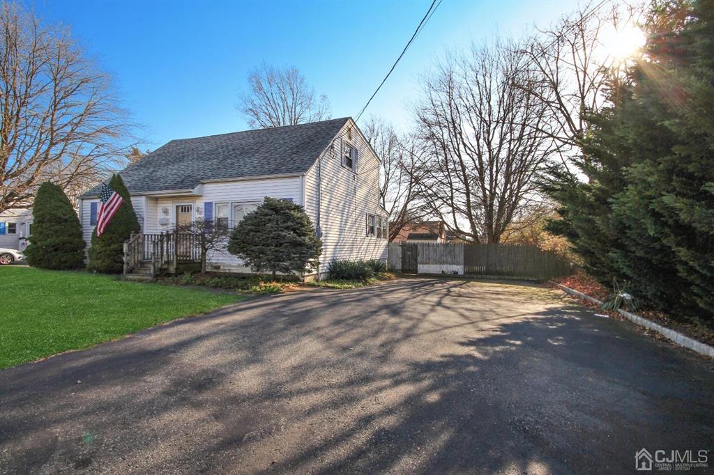 49 Racetrack Road East Brunswick, NJ 08816 - Photo 2 of 20 a view of a house with a yard and garage