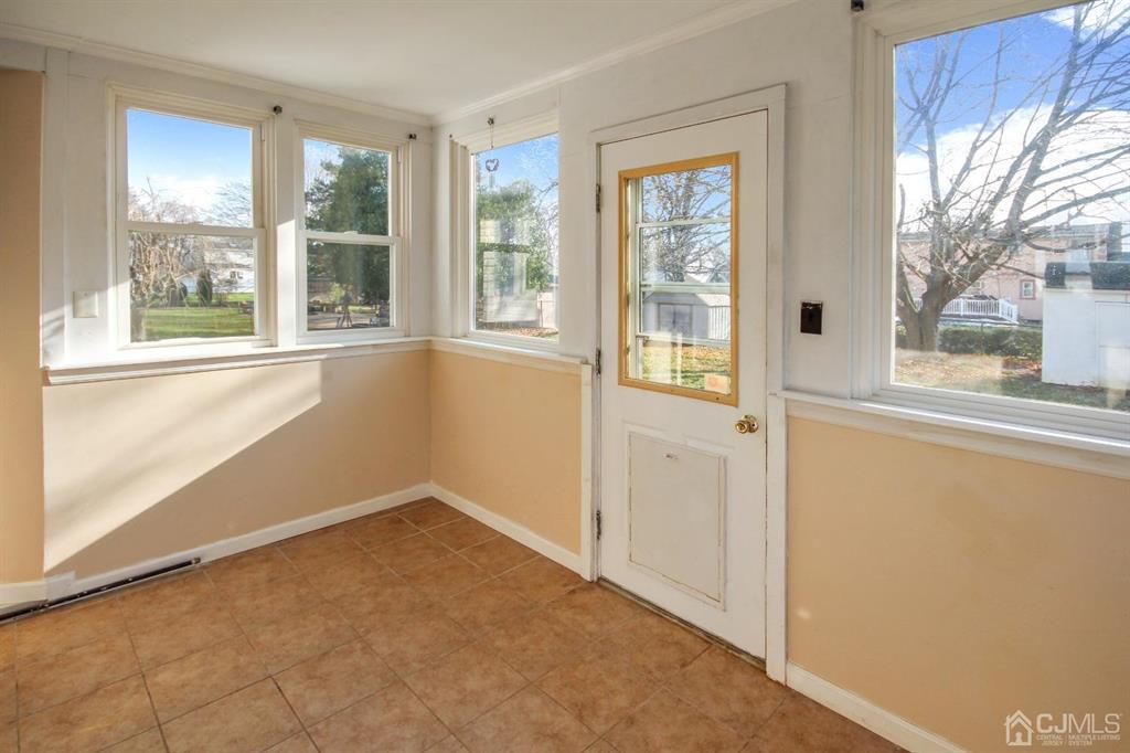 49 Racetrack Road East Brunswick, NJ 08816 - Photo 7 of 20 a view of an empty room with a window