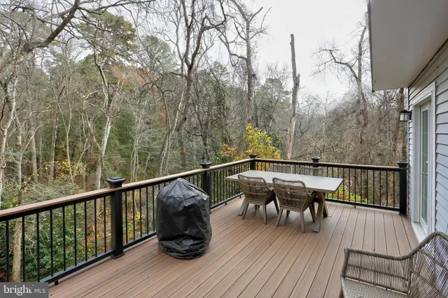 a view of balcony with furniture and wooden floor