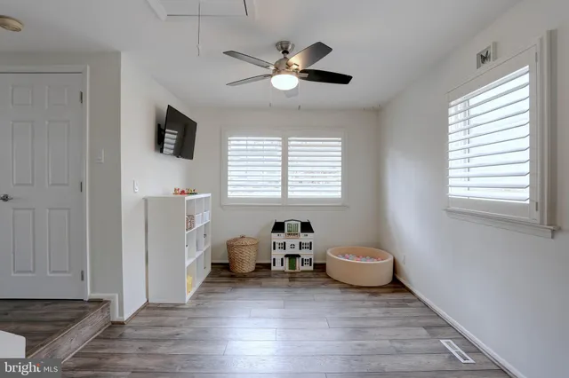 a room with furniture and a wooden floor