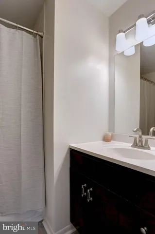 a living room with furniture and a closet