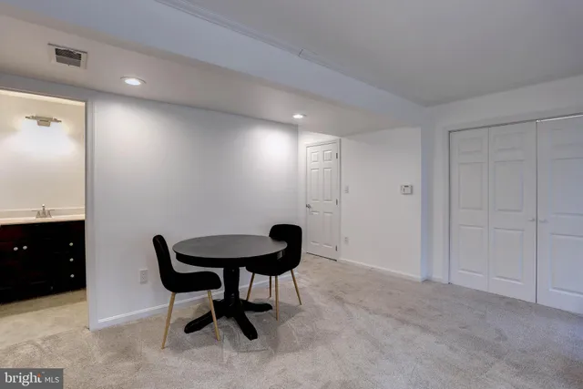 a bathroom with a sink mirror toilet and shower