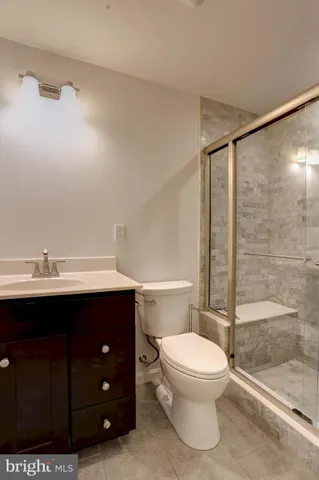 a bathroom with a shower and a toilet