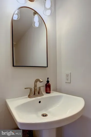 a view of a storage utility room with a sink