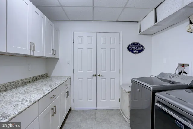 a kitchen with cabinets appliances