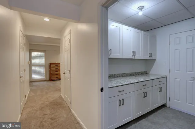 a balcony with furniture and wooden floor