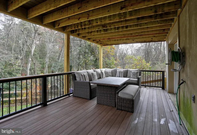 a roof deck with a table and chairs