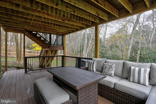 a outdoor living space with furniture and wooden floor