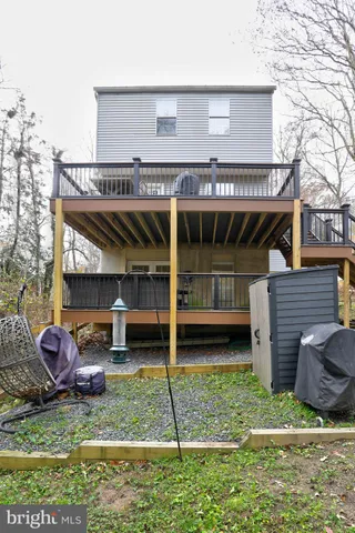 a view of a house with a backyard and a patio