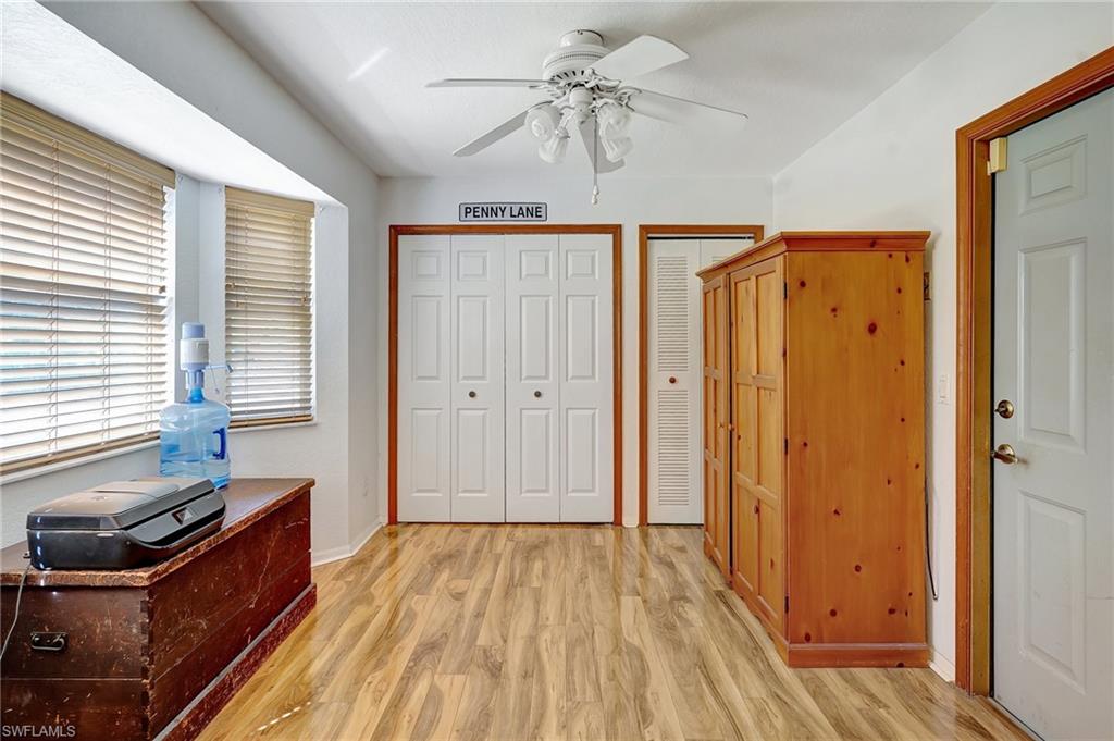 3520 2nd Avenue Northeast Naples, FL 34120 - Photo 15 of 39 a view of a room with wooden floor and a window