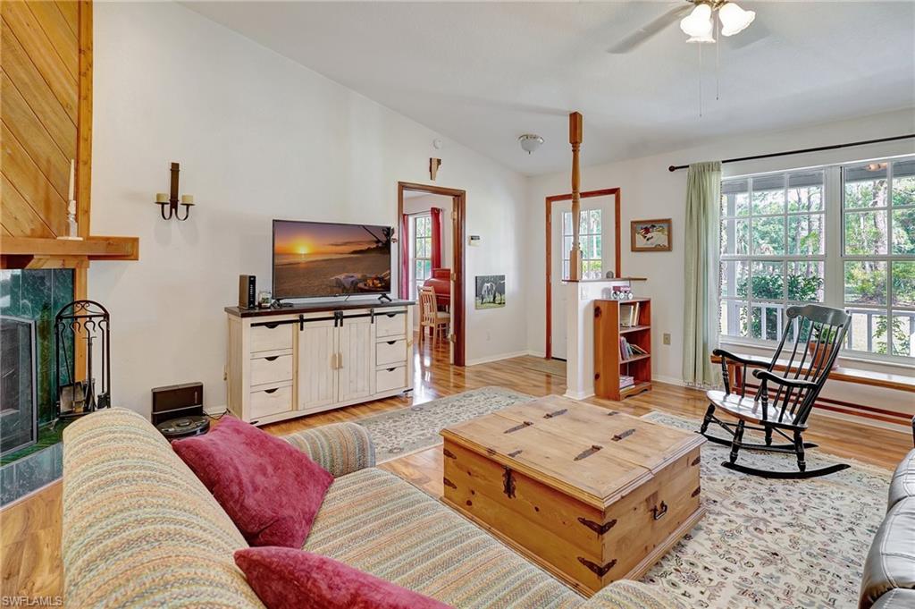 3520 2nd Avenue Northeast Naples, FL 34120 - Photo 20 of 39 a living room with furniture and a flat screen tv