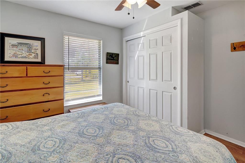 3520 2nd Avenue Northeast Naples, FL 34120 - Photo 22 of 39 a view of a bedroom with cabinet and closet