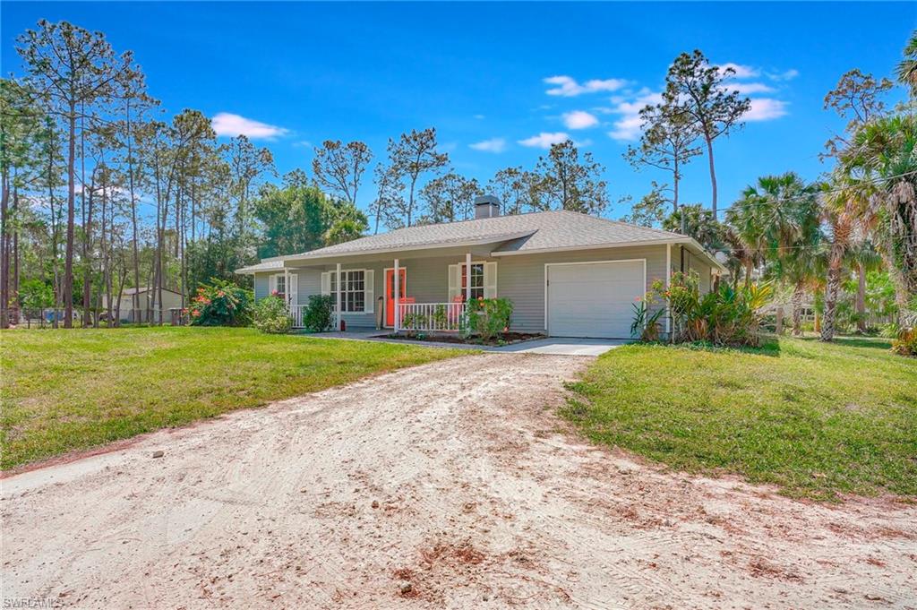 3520 2nd Avenue Northeast Naples, FL 34120 - Photo 3 of 39 a view of house with a garden