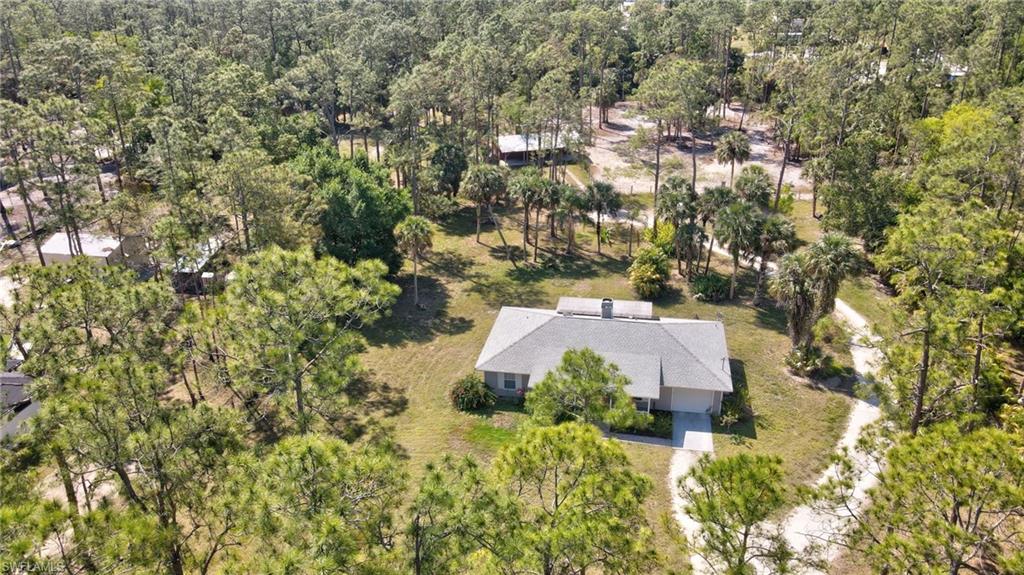 3520 2nd Avenue Northeast Naples, FL 34120 - Photo 33 of 39 an aerial view of a house with a yard