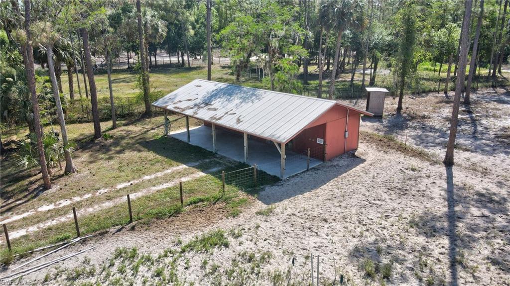 3520 2nd Avenue Northeast Naples, FL 34120 - Photo 4 of 39 a view of a wooden deck and yard