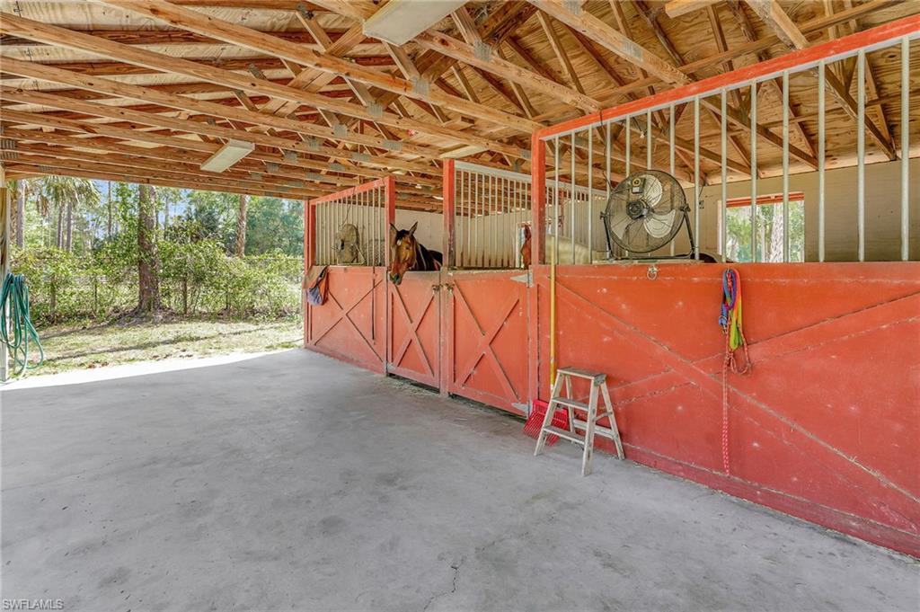 3520 2nd Avenue Northeast Naples, FL 34120 - Photo 5 of 39 a view of a room with wooden walls