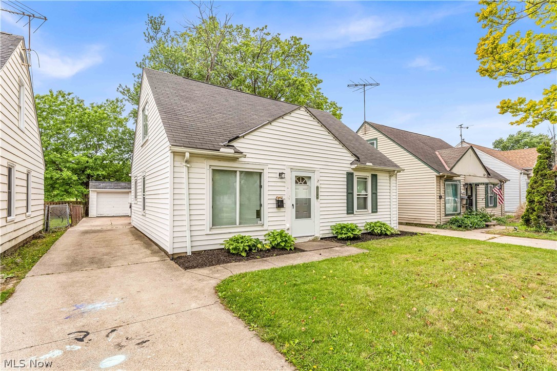 18517 Homeway Road Cleveland, OH 44135 - Photo 1 of 29 White siding exterior with a dark shingle roof and front lawn