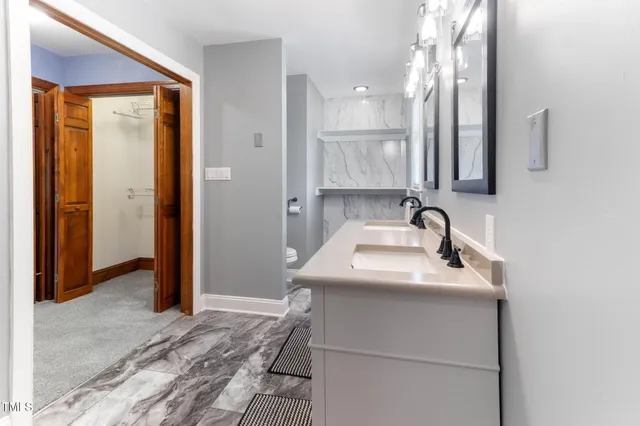 a bathroom with a shower and a tub