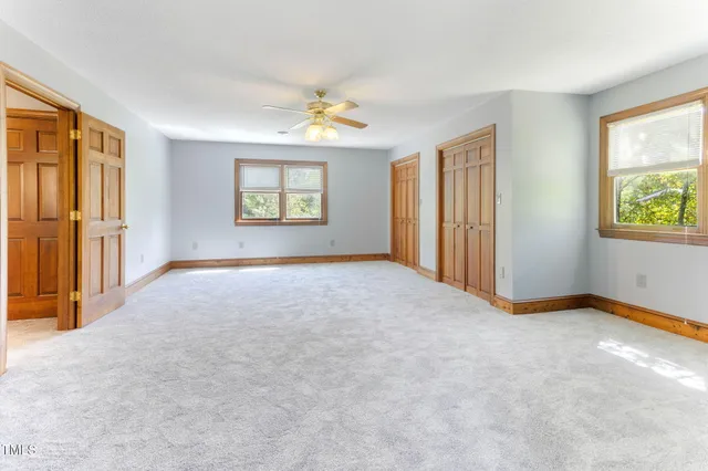 a view of a hallway view with staircase