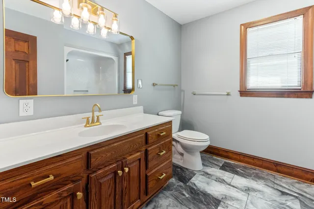 a bathroom with a toilet and a bathtub