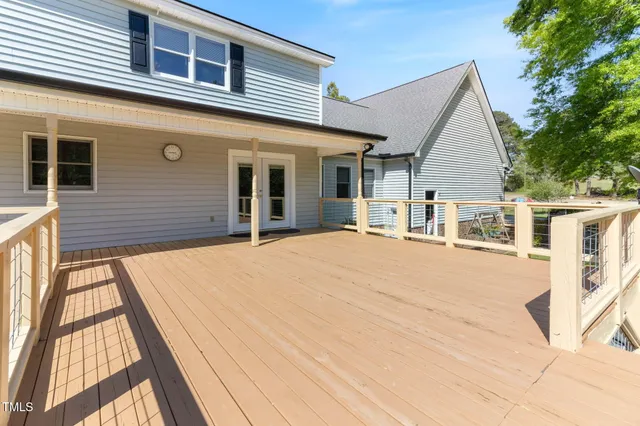 a house with swimming pool in front of it