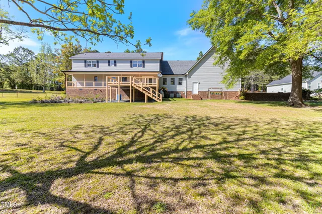a view of a yard with a tree