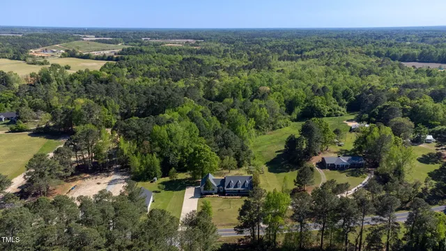 an aerial view of a house with outdoor space