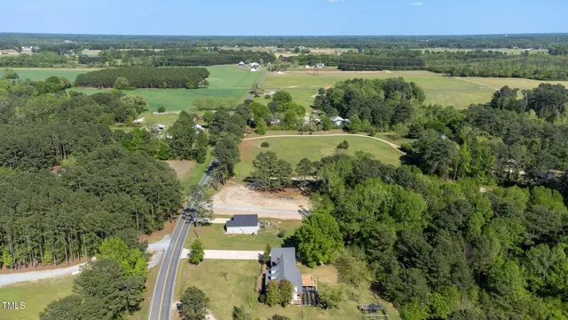 a aerial view of a house with a yard