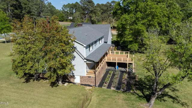 a front view of a house with swimming pool having outdoor seating