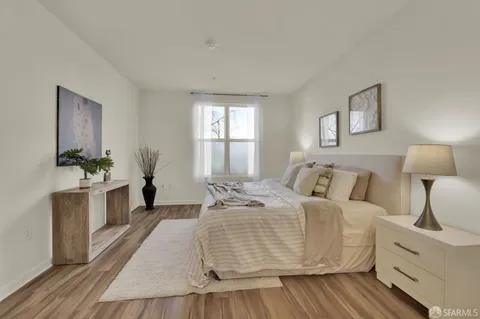 a bedroom with a bed and a dresser